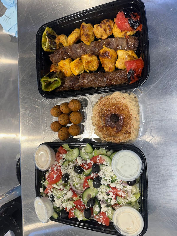 Kebab plate with hummus and sides